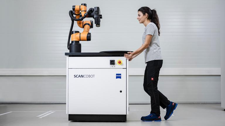 Operator easily moving ZEISS ScanCobot mobile workstation for effortless 3D scanning operation by Factory Max