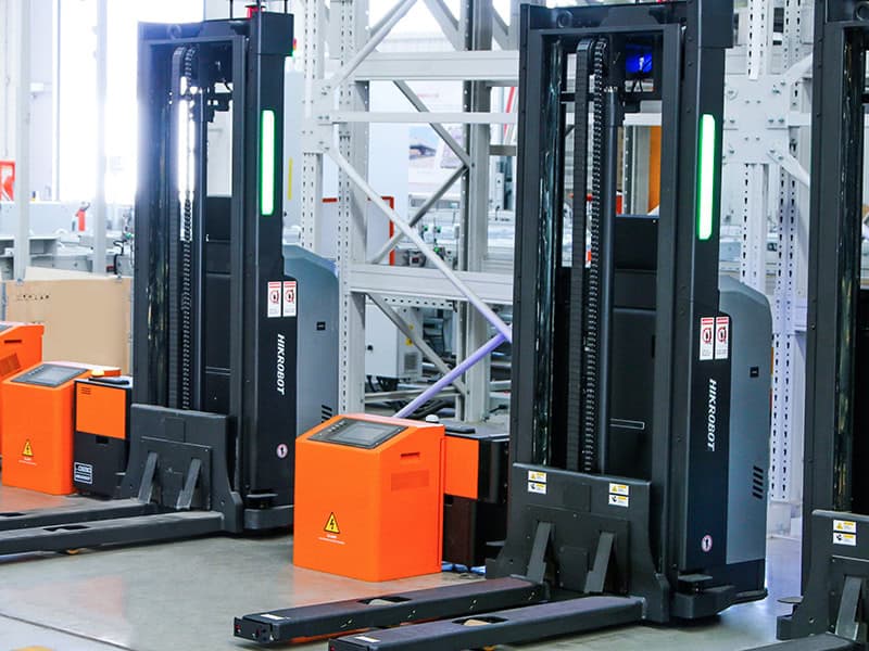 Self lubricating industrial chains installed on automated forklift AGV system to reduce maintenance burden and downtime